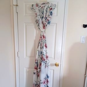 Ivory dress with pink & blue flowers halter top style sides out criss-cross back